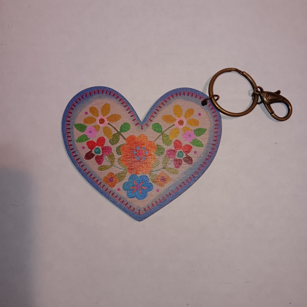 The Natural life double sided, multicolored floral heart keychain.